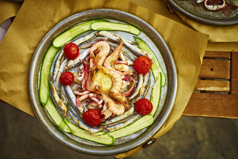 Fish dish Genoese on hot serving plate stock photo