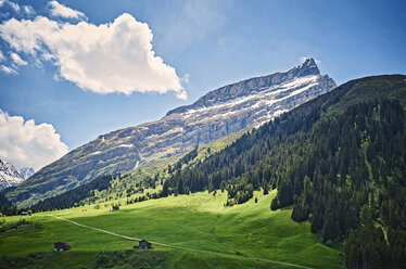 Switzerland, Grisons, Sufers, Alps, mountain pasture with alpine huts, near San Bernardino Pass - DIKF000161