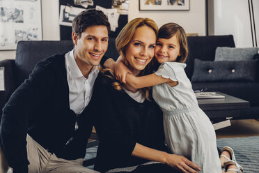 Happy family with daughter in living room - CHAF000995