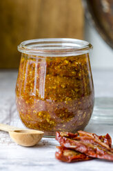 Preserving jar of homemade tomato pesto - ODF001175