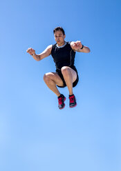 Spain, Athlete jumping, mid-air - MGOF000371