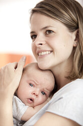 Portrait of happy young woman with her baby - MFRF000299