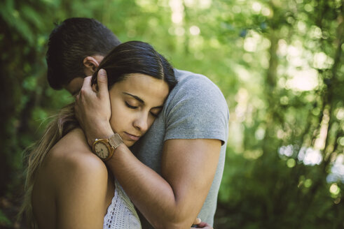 Young woman resting her head on the chest of her boyfriend - RAEF000267