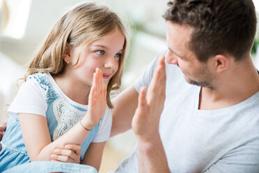 Father and daughter giving high five - WESTF021486