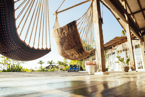 Indonesia, Bali, hammocks on terrace of a holiday villa - MBEF001408