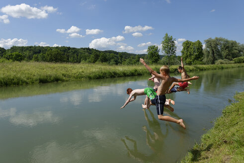 Germany, Bavaria, kids and man jumping into River Loisach - LBF001169