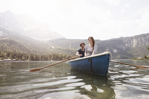 Germany, Bavaria, Eibsee, couple in rowing boat on the lake stock photo