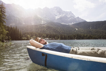Germany, Bavaria, Eibsee, man in rowing boat on the lake - RBF003040