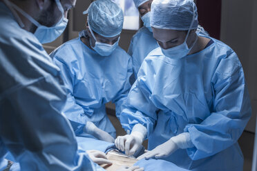 Surgical team preparing patient for operation - ZEF007464