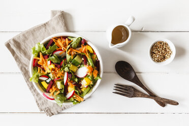 Mixed salad in bowl on wood - EVGF002016