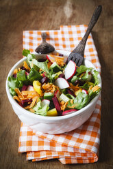 Mixed salad in bowl on wood - EVGF002019