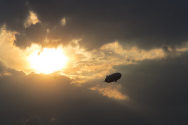 Germany, Oberschleissheim, Silhouette of Zeppelin NT, mid-air - PEDF000061