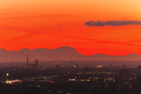 Germany, Bavaria, Munich, Cityscape at sunset with Alps in background - PEDF000062