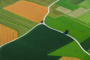 Germany, Bavaria, View of fields and country road, aerial view - PEDF000145