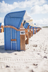 Germany, Warnemuende, hooded beach chairs on the beach - ASCF000297