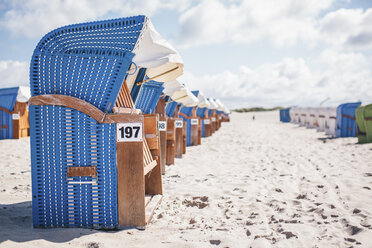 Germany, Warnemuende, hooded beach chairs on the beach - ASCF000298