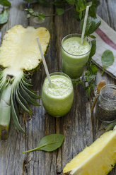 Two glasses of spinach pineapple smoothie with chia and mint - ODF001200