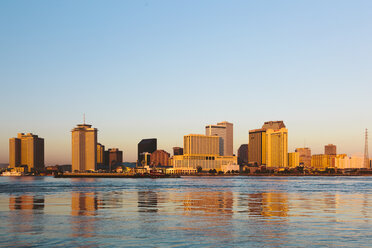 USA, New Orleans reflected in the Mississippi river at sunrise - GIOF000088