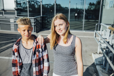 Portrait of two teenagers on pedestrian bridge - AIF000037