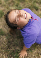 Portrait of girl with closed eyes relaxing on a meadow - MGOF000413