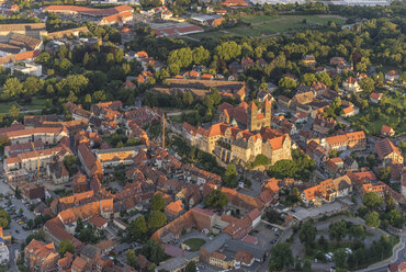 Germany, aerial view of Quedlinburg with collegiate church at evening twilight - PVCF000588