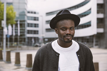 Portrait of smiling young man wearing hat outdoors - STKF001395