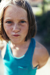 Portrait of girl with brown hair and freckles - MGOF000431