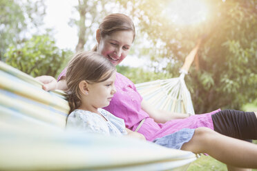 Relaxed mother and daughter in hammock - RBF003452