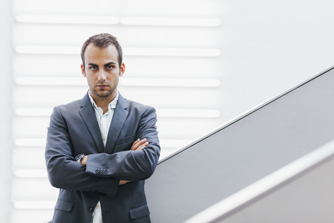 Portrait of businessman with crossed arms stock photo