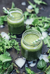 Two glasses of wild herb smoothie with apple, banana and lime juice - IPF000236