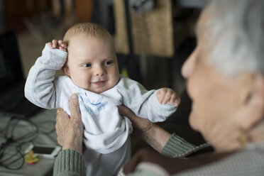 Portrait of baby boy being held by his great-grandmother - RAEF000308