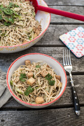 Otsu salad with soba noodles, tofu, cucumber, sesame, spring onion and coriander in bowl - SARF002082