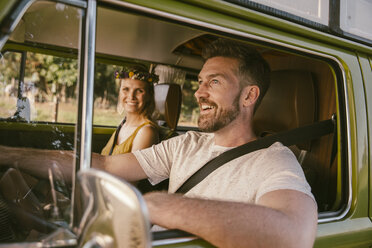 Smiling couple in van on a road trip - MFF002048