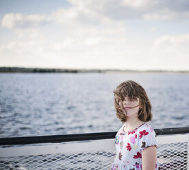 Girl on a ferry with blowing hair - CAMF000004