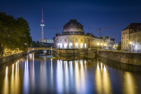 Germany, Berlin, Bode Museum at the Spree river with TV-Tower at night - NKF000352