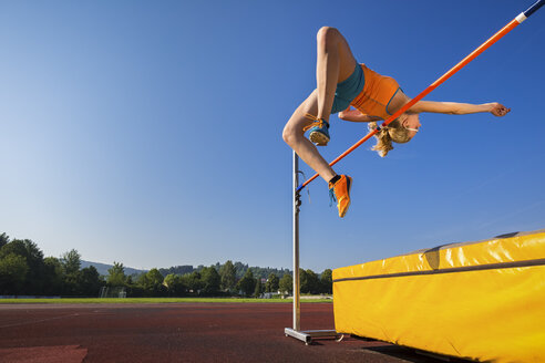 Young athlete training high jump - STSF000855