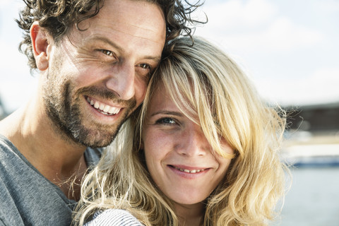 Portrait of smiling couple outdoors stock photo