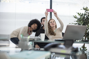 Colleagues in office taking a selfie - ZEF007187