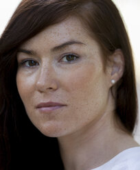 Portrait of woman with brown hair and freckles, close-up - HCF000148