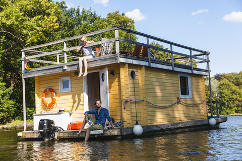 Couple having a trip on a house boat stock photo