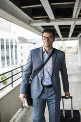 Portrait of businessman on business trip - UUF005354