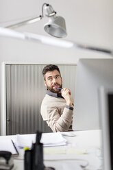 Man in office sitting at desk - PESF000095