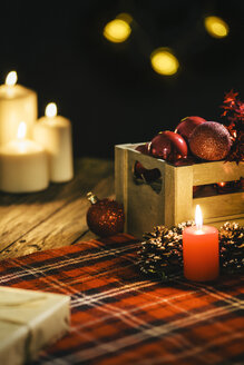 Christmas decoration with burning candles and checkered blanket - AKNF000021