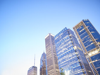 USA, Illinois, Chicago, High-rise buildings in the evening - DISF002159