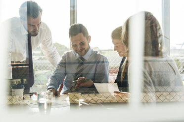 Business people having a meeting in conference room - UUF005497