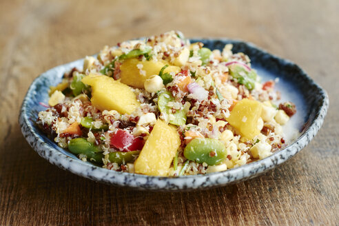 Quinoa salad with mango, carrots, fava beans, red bell pepper, red onion, corn, coconut and raisins - HAWF000846