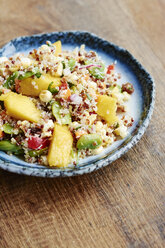 Quinoa salad with mango, carrots, fava beans, red bell pepper, red onion, corn, coconut and raisins - HAWF000847