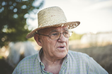 Portrait of farmer wearing straw hat - RAEF000404