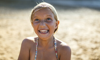 Portrait of girl making face on the beach - MGOF000610