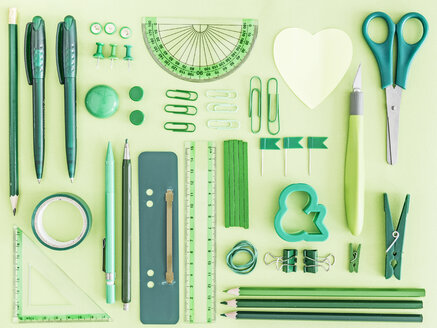 Green office supplies on green background - MELF000070